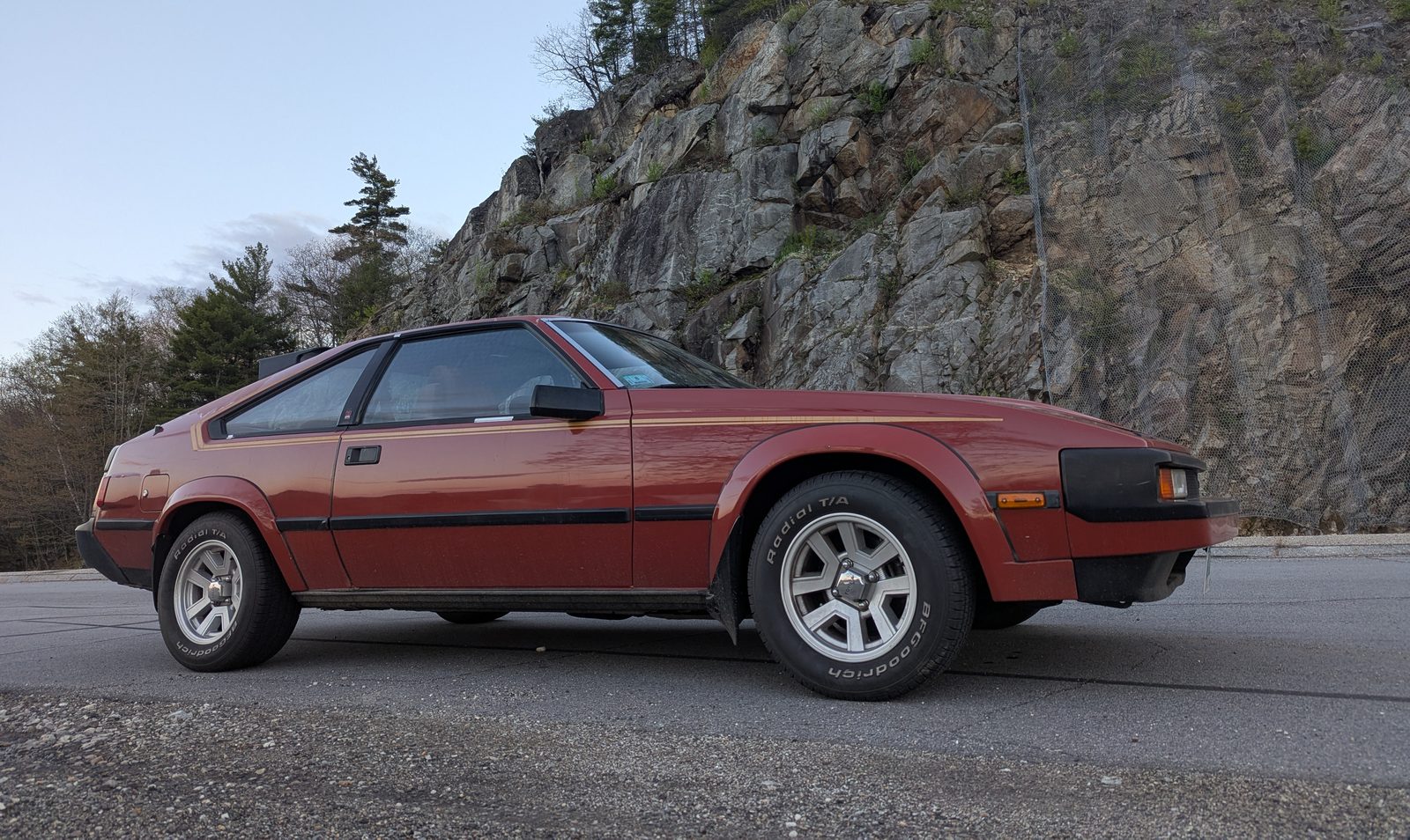 The founder's red 1983 Toyota Celica Supra, seen from the front three-quarter.